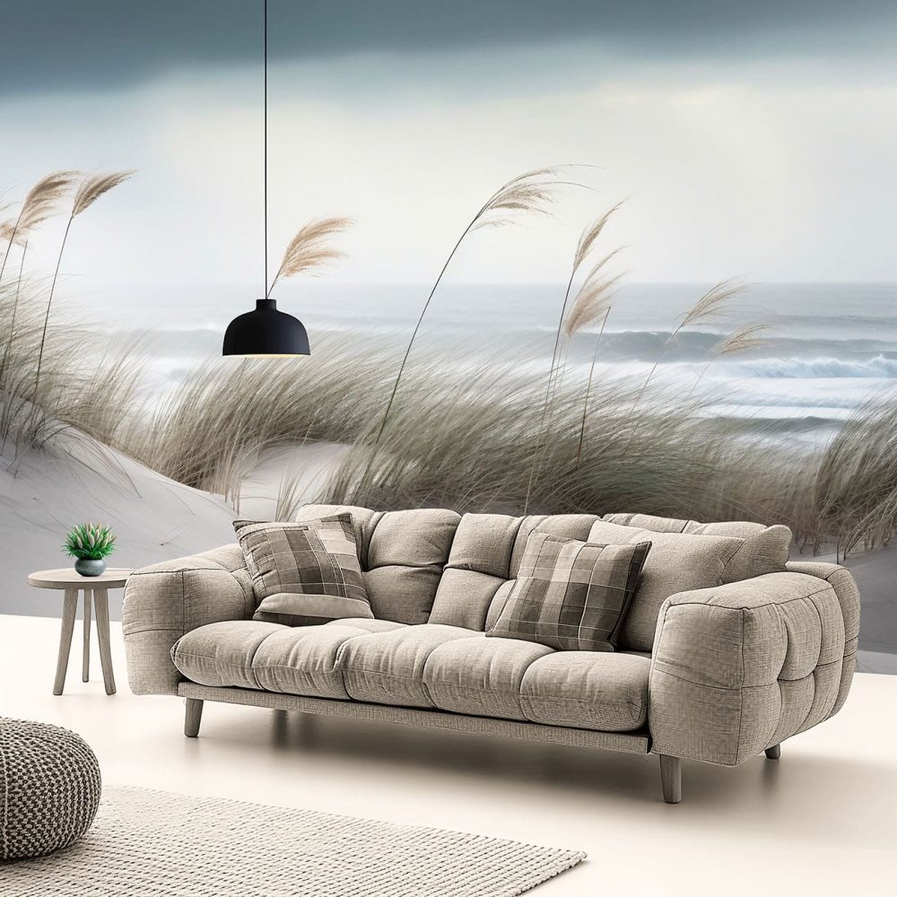 Grass growing on the dunes alongside rolling waves wall mural from Wallpaper Online South Africa