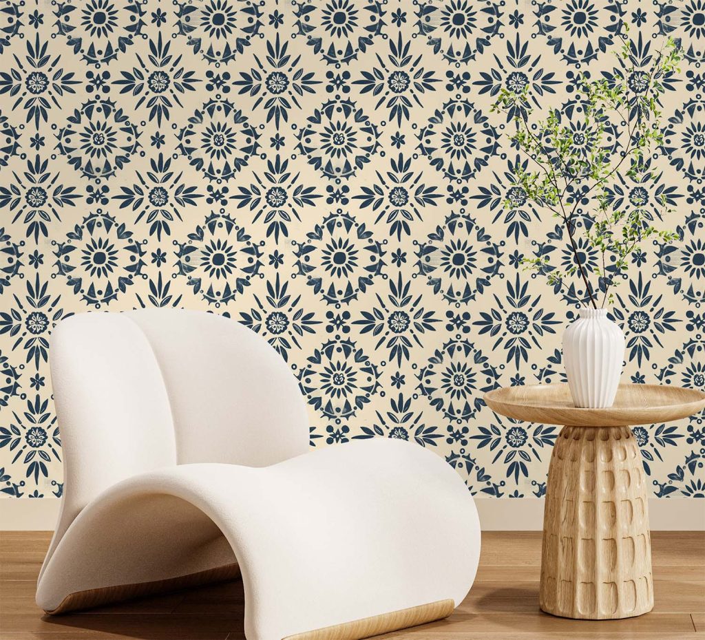 A hand-painted floral wallpaper with deep blue folk-inspired motifs on a warm beige background, blending traditional charm with modern simplicity.