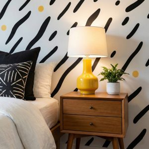 A zoomed-in of a black dash pattern wallpaper that adds energy and texture to minimalist interiors