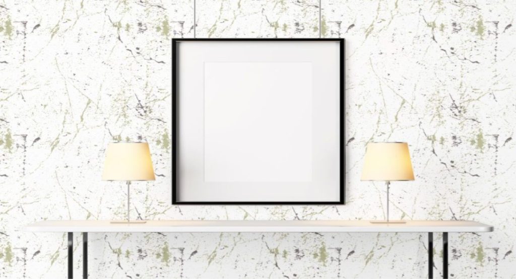 Transform Your Walls with Marble Wallpaper: A Guide to Stone Effect Murals 5 Wallpaper and Wall Murals South Africa Black framed picture mockup on a Cleo Wallpaper above a white table with two lamps