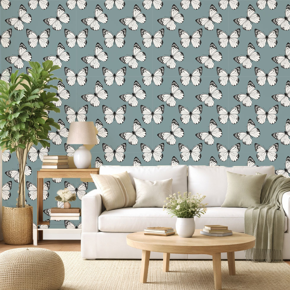 Butterfly Breeze wallpaper in blue-grey installed in a modern living room with light wood furniture and soft decor.