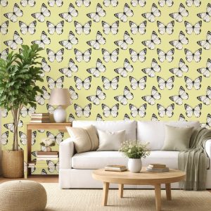 Butterfly Breeze wallpaper close-up with black and white butterflies on a soft yellow background