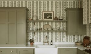 A zoomed-in of Sage Totem wallpaper highlighting textured olive geometric stripes and organic stacked motifs