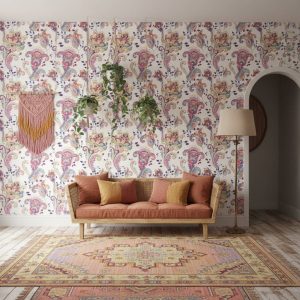 Colours of Joy damask wallpaper with purple, pink and gold paisley motifs on cream across a nursery feature wall — Wallpaper Online South Africa