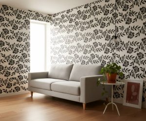 Equilateral Line floral wallpaper with black botanical linework on white background across a contemporary bedroom — Wallpaper Online South Africa