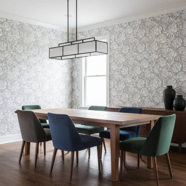 Mistry Rose floral wallpaper with white roses and grey foliage on pale grey background across a dining room — Wallpaper Online South Africa