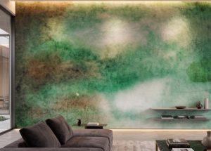 A zoomed-in of Emerald Drift Mural showcasing layered emerald and moss-toned watercolor textures behind a contemporary sofa.