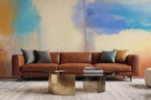 Sunlit Horizon Mural displayed as a feature wall in a contemporary living room with warm blue and terracotta abstract tones.