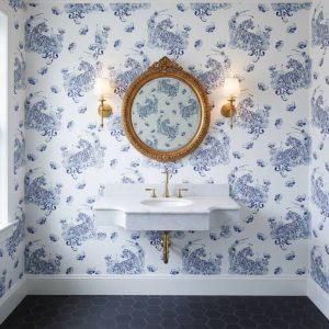 Tiger Winds wallpaper with graceful tigers and ornamental clouds in navy blue and light blue on white across a powder room — Wallpaper Online South Africa