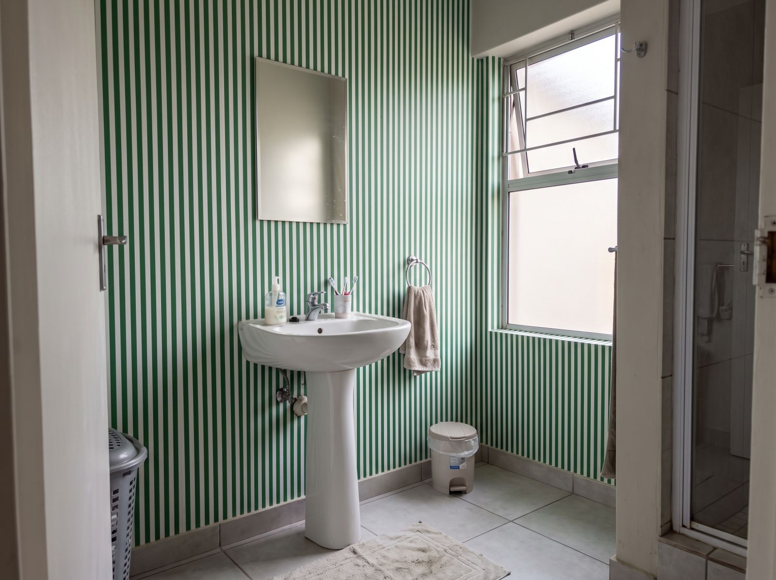 Seafoam Stripes Wallpaper 1 Wallpaper and Wall Murals South Africa Seafoam Stripes Wallpaper shown in a bathroom