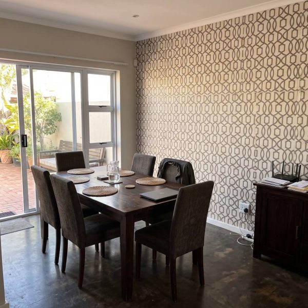 Pizazz Trellis Taupe shown in a dining room