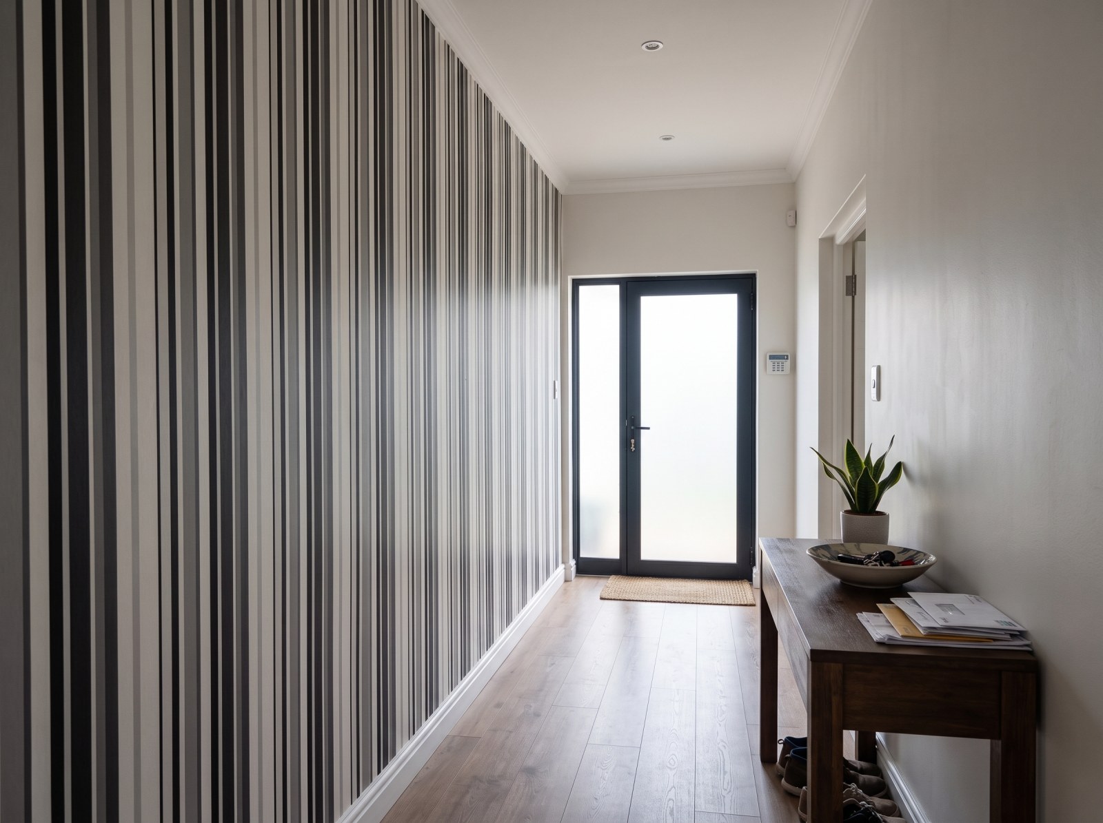 Uneven Stripe Graphite 3 Wallpaper and Wall Murals South Africa Uneven Stripe Graphite shown in a hallway
