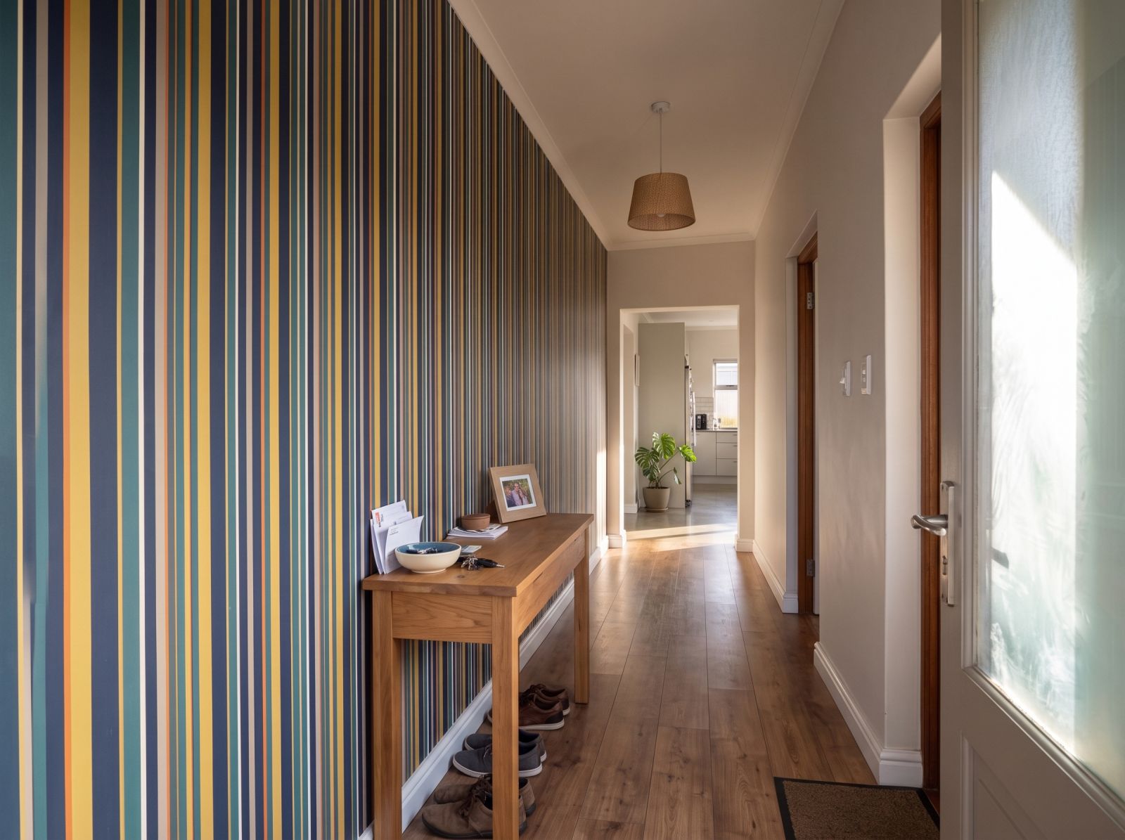 Uneven Stripe Midnight Brass 3 Wallpaper and Wall Murals South Africa Uneven Stripe Midnight Brass shown in a hallway